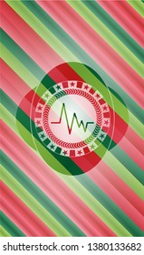 electrocardiogram icon inside christmas colors style badge.