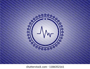 electrocardiogram icon inside emblem with denim texture