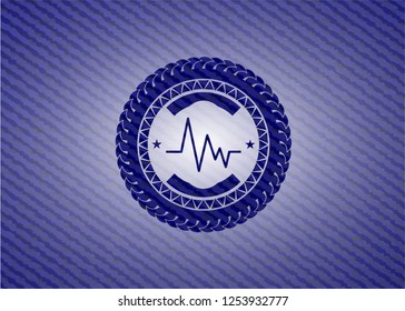 electrocardiogram icon inside emblem with denim texture