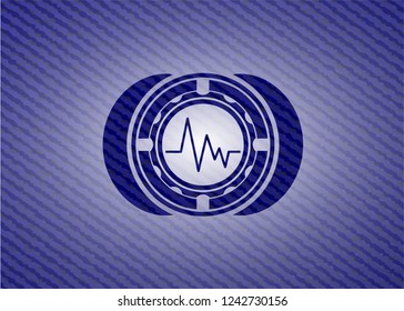electrocardiogram icon inside emblem with jean background