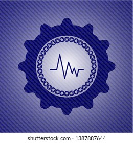 electrocardiogram icon inside emblem with jean texture