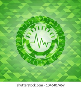 electrocardiogram icon inside green emblem with mosaic background