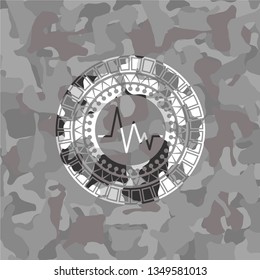 electrocardiogram icon inside grey camo texture