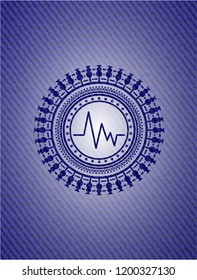 electrocardiogram icon inside jean or denim emblem or badge background