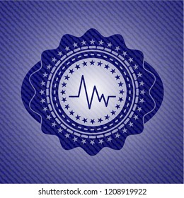 electrocardiogram icon inside jean or denim emblem or badge background