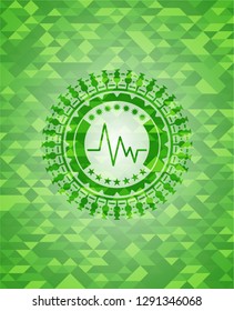 electrocardiogram icon inside realistic green mosaic emblem