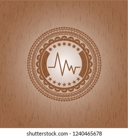 electrocardiogram icon inside realistic wood emblem