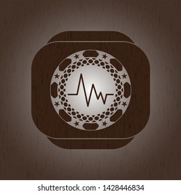 electrocardiogram icon inside realistic wooden emblem
