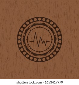 electrocardiogram icon inside retro style wooden emblem
