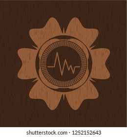 electrocardiogram icon inside retro wood emblem