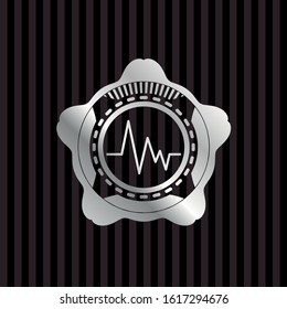 electrocardiogram icon inside silvery emblem