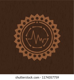 electrocardiogram icon inside wood badge or emblem
