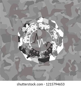 electrocardiogram icon on grey camo pattern