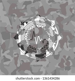 electrocardiogram icon on grey camo texture