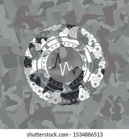 electrocardiogram icon on grey camo pattern