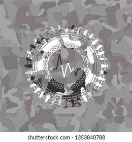 electrocardiogram icon on grey camouflage pattern