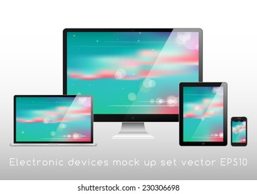 Electronic devices mockup set - laptop, monitor, tablet and smartphone vector illustration