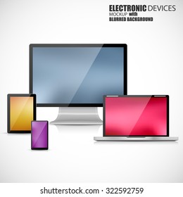 Electronic devices mockup set of laptop, tablet computer, monitor and smartphone with blurred background