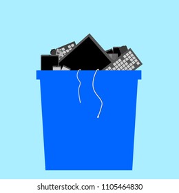 electronic waste in blue recycle bin