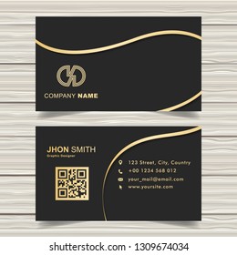 elegant black business card with golden ribbon details