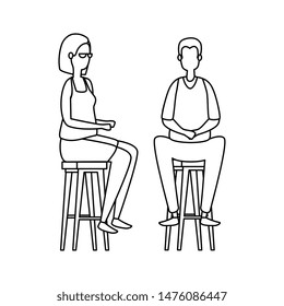 elegant business couple seated in benchs