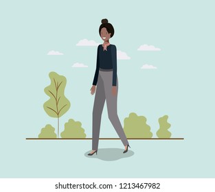 elegant businesswoman walking in the park