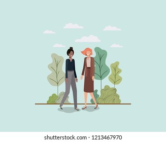 elegant businesswomen walking in the park