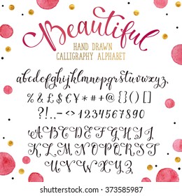 Elegant calligraphy letters with florishes. Handwritten alphabet with watercolor spots on background. Uppercase, lowercase letters, numbers and symbols. Hand drawn modern script. 