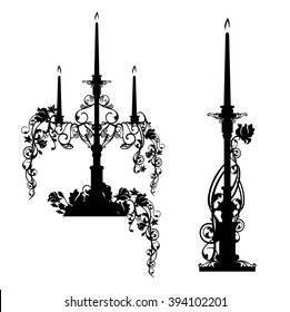 elegant candlesticks among rose flowers - black and white vector design set