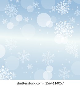 Elegant Christmas Background. light bokeh blue Christmas Abstract holiday pattern. Balls, gradient, snowflakes are on blue New Year background