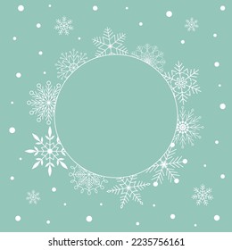 Elegant Christmas New Year greeting card with white snowflake round frame with copy space on turquoise background. Minimalist retro vintage style template for holiday banner
