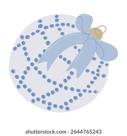 Elegant Christmas ornament with dotted pattern and decorative bow in pastel blue tones. Concept of holiday decoration, festive spirit and seasonal celebration