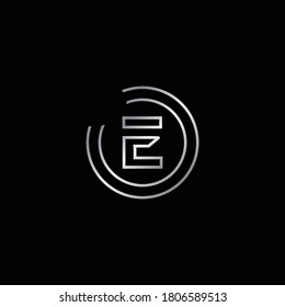 Diseño elegante del alfabeto E. Diseño De Logotipo De Gabinete Plateado Para La Letra E. La letra mayúscula E se adjunta en dos círculos. Diseño de logotipo moderno y único para la letra E.