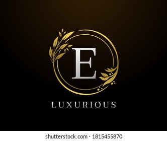 Elegant E Letter Floral Design. Circle Luxury E Gold Logo Icon.