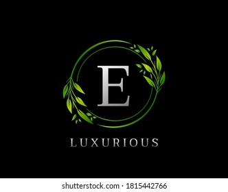 Elegant E Letter Green Floral Design. Circle Green Leaf E Logo Icon.