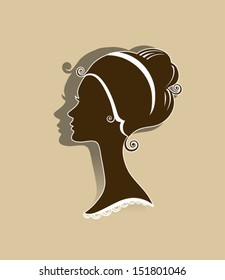 Elegant female profile with a hairdo in the Empire style.