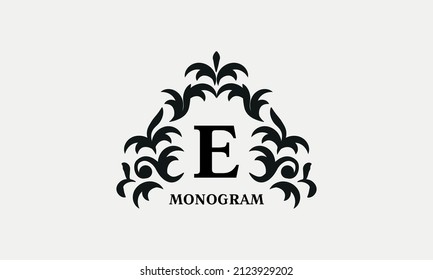 Elegant floral logo design template for letter E. Calligraphic dark elegant ornament on white background. Business sign, identity monogram for restaurant, boutique, hotel, heraldic, jewelry.