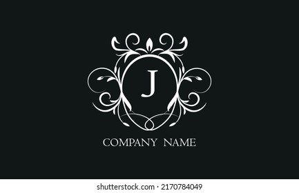 Elegant floral monogram with decorative elements and the letter J. Template for invitations, labels, business. Wedding monograms. Exquisite calligraphic ornament.