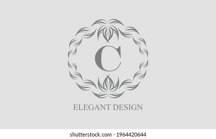 Elegant floral monogram with exquisite elements. Template for invitations, labels, business signs. Vintage ornament with calligraphic letter C.