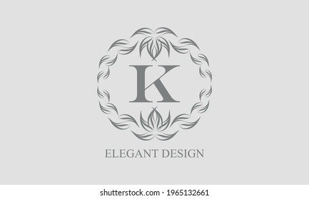 Elegant floral monogram with exquisite elements. Template for invitations, labels, business signs. Vintage ornament with calligraphic letter K.