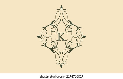 An elegant floral monogram template for one or two letters such as K. Exquisite calligraphic ornament. Business sign, monogram is identical for restaurant, boutique, cafe, hotel and other