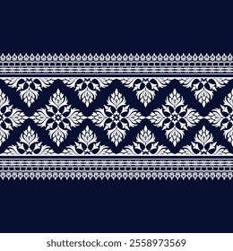 An Elegant floral pattern on dark blue background, featuring intricate white designs. This decorative motif is perfect for textiles, wallpapers, and various crafts