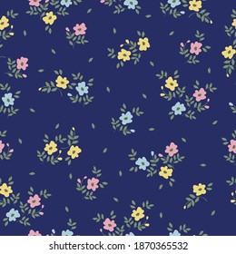 Elegant floral pattern in pink, yellow and pink flowers. Dark blue background. The style of freedom. Floral seamless background for fashion prints. Printing color in a flower. Seamless vector texture.