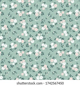 Elegant floral pattern in small pale pink and white flowers. Liberty style. Floral seamless background for fashion prints. Ditsy print. Seamless vector texture. Spring bouquet.