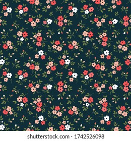 Elegant floral pattern in small red and pink flowers. Liberty style. Floral seamless background for fashion prints. Ditsy print. Seamless vector texture. Spring bouquet.