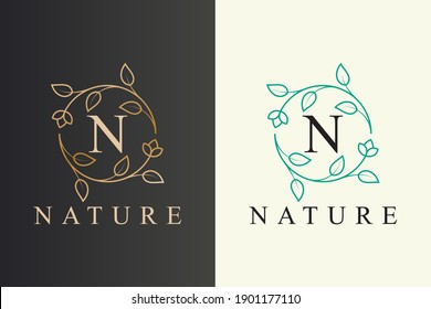 elegant flower and leaf line art style nature logo design with the initial letter