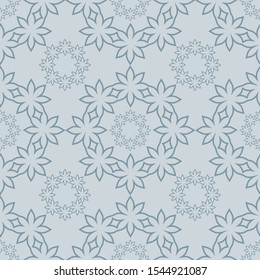 Elegant and gentile ornamental  seamless vector pattern in light grey blue shades. 