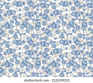 Elegant gentle trendy pattern in small-scale flower. Millefleurs. Liberty style. Floral seamless on blue background for textile, mens wear, cotton fabric, covers, wallpapers, print,