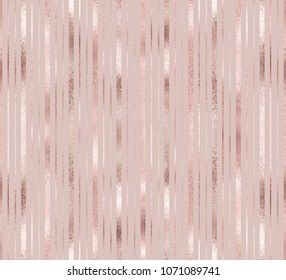 Elegant geometric seamless pattern with rose gold and golden vertical stripes.