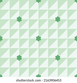 Elegant green and white seamless pattern. The background is a two-tone white and pastel green. There were small green flowers placed far apart, make it look beautiful, simple but chic and charming.